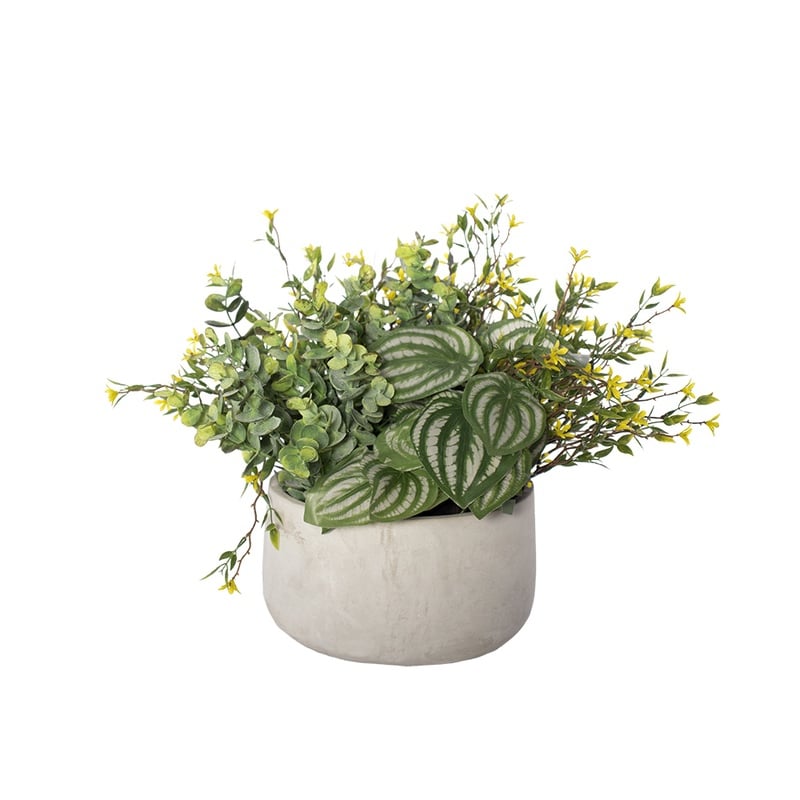 Plante artificielle en pot avec fleurs jaunes