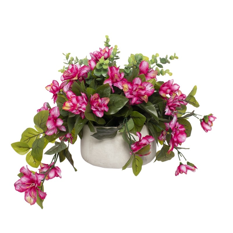 Plante artificielle en pot avec fleurs roses